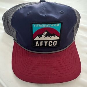 Men Aftco navy hat with burgundy brim. SnapBack with gray . Stain on brim.